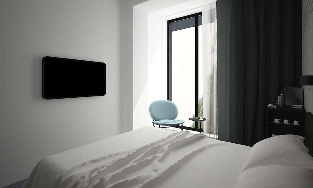 Golden Tulip Design Tbilisi Otel Oda fotoğraf